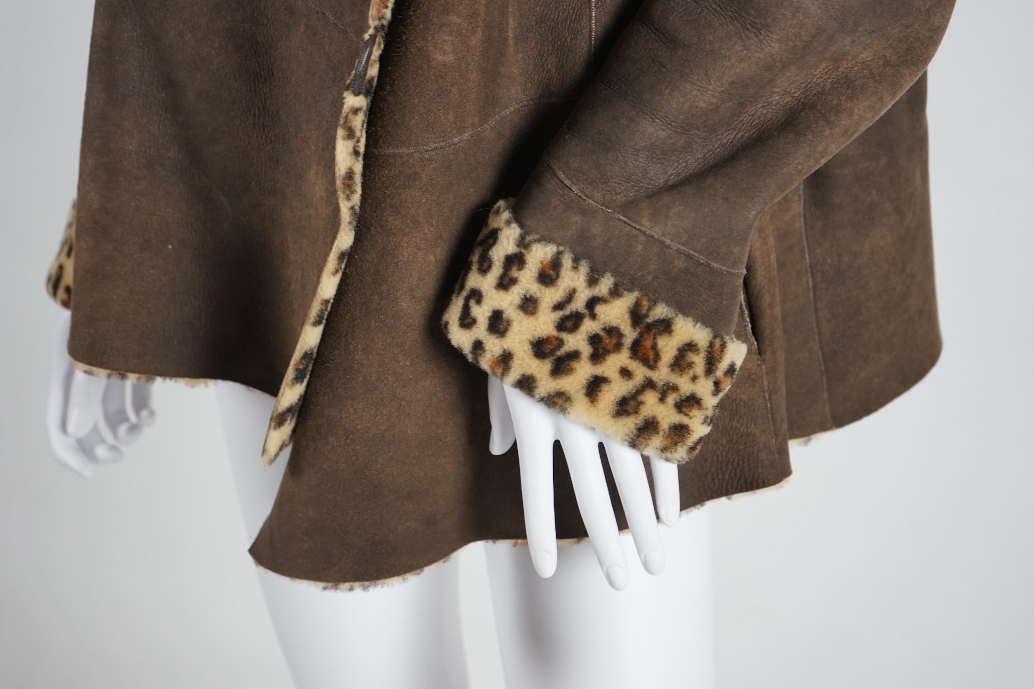 A Marc Caine lady's faux suede coat and three tops. Approx sizes 14-16 Proceeds to Happy Paws Puppy Rescue